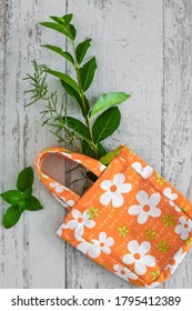 Cotton Bag With Flower Print And Fresh Mint, On The White Rustic Background, Top View