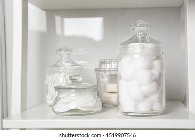 Cotton Balls, Swabs And Pads On White Shelf In Bathroom