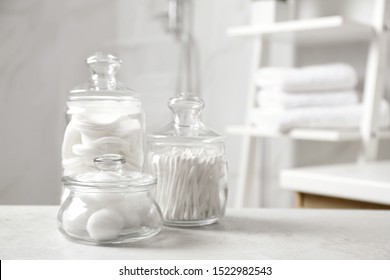 Cotton Balls, Swabs And Pads On Light Grey Table In Bathroom