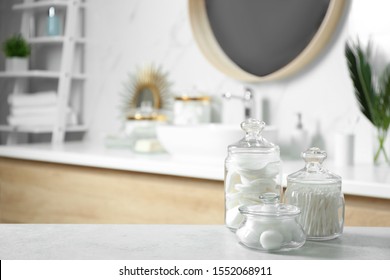 Cotton Balls, Swabs And Pads On Light Grey Table In Bathroom