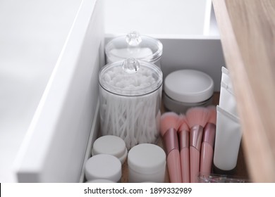 Cotton Buds, Pads, Creams And Makeup Brushes In Open Drawer