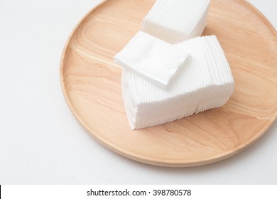 Cotton For Facial Cleansing Wipes On Wooden Plate.