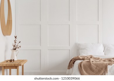 Cotton Flower In Rustic Vase On The Dresser Of Bedroom Designed With Natural Materials, Real Photo With Copy Space On The Empty Wall