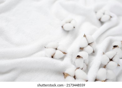 Cotton flowers on a white terry towel with copy space. - Shutterstock ID 2173448559