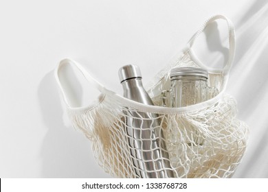 Cotton Net Bag With Reusable Metal Water Bottle, Glass Jar And Straw. Zero Waste Concept. Eco Friendly