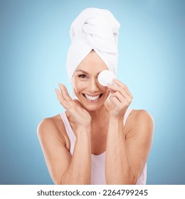 Cotton pad, skincare and portrait of woman for beauty, cleaning cosmetics and wellness on blue background. Happy female model remove makeup for face cleaning, aesthetic dermatology and shower product - Powered by Shutterstock