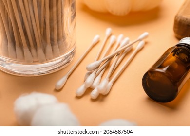 Cotton Swabs, Balls And Cosmetic Product On Color Background, Closeup