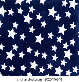 Cotton texture as background,
Seamless pattern tiny white stras design on dark blue cotton texture fabric.