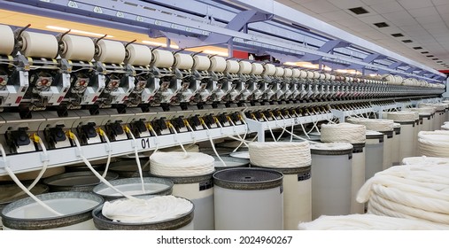 Cotton thread spinning machines, beautiful images from the interior of a spinning factory - Powered by Shutterstock