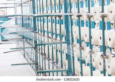 Cotton Threads Coming From Multiple Small Cotton Cones And Combined Together In A Yarn Factory