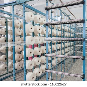 Cotton Threads Coming From Multiple Small Cotton Cones And Combined Together In A Yarn Factory