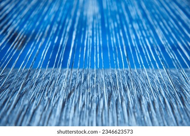 Cotton threads in industrial cotton in a weaving factory, machine weaving cotton for the fashion and textiles industry. Yarn weave traditional textile fabric manufacturing for clothing and fashion
 - Powered by Shutterstock