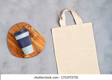 Cotton Tote Bag And Reusable Coffee Cup Mockup. Zero Waste Living, Sustainability, Eco Friendly Lifestyle. Top View, Flat Lay