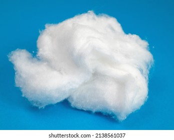 Cotton wadding against a blue background