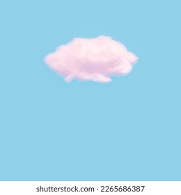 Cotton wool cloud isolated on blue background with copy space. Clouds made of real cotton.