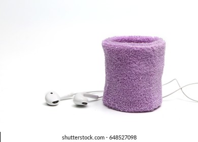cotton wrist band and earphone on white background