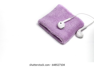 Cotton Wrist Band And Earphone On White Background