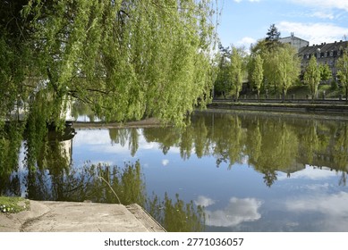 couds reflected in the calm river