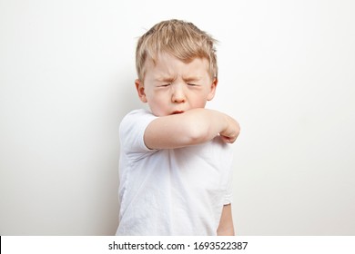 Cough in the elbow. Prevention barrier gestures to curb the covid-19 - Powered by Shutterstock