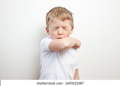 Cough In The Elbow. Prevention Barrier Gestures To Curb The Covid-19