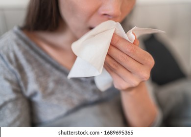 Cough In Tissue Covering Nose And Mouth When Coughing As COVID-19 Hygiene Guidelines For Coronavirus Spread Prevention.