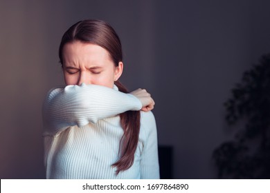 Cough In Tissue Covering Nose And Mouth When Coughing. European Woman Sick With Flu At Home.