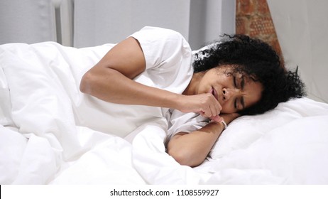 Coughing Sick Afro-American Woman In Bed At Night, Throat Infection, Lying On Side