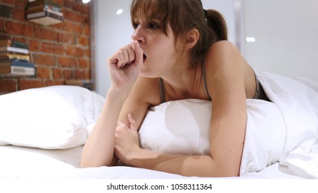 Coughing Sick Woman Lying In Bed At Night