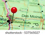 Council Bluffs pinned on a map of Iowa, USA
