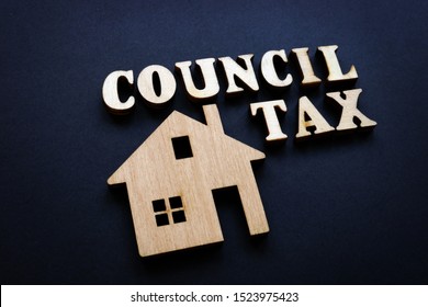 Council Tax And Model Of Home From Wood.