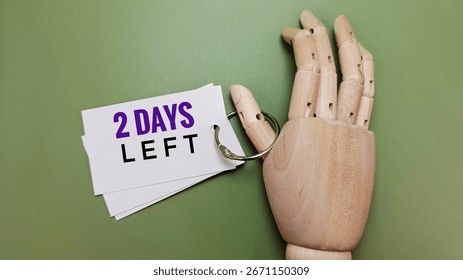Countdown concept with 2 days left text, urgency, deadline, time running out, reminder, calendar, schedule, business, planning, alert, warning, motivation, concept. 