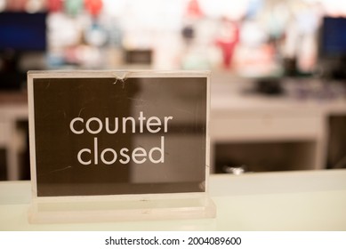 Counter Closed sign on a cashier table. Concept of business, economy and pandemic