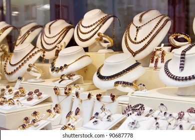 Counter With Garnet Jewelry In Store Window