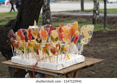 Counter with homemade colorful lollipops for trading on the street. - Shutterstock ID 1147125941