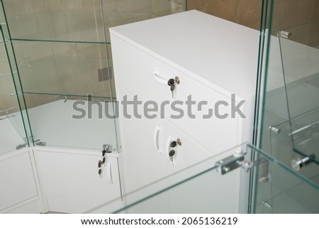 counter for retail sale of goods in a store made of glass and wooden panels. Equipment forsale of products. concept is business