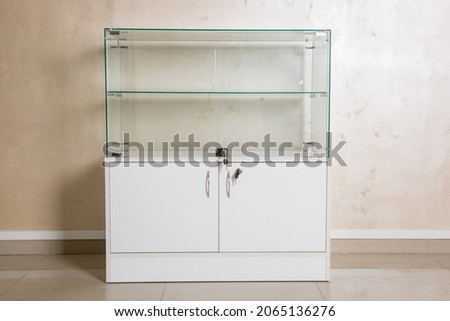 counter for retail sale of goods in a store made of glass and wooden panels. Equipment forsale of products. concept is business