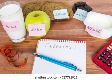 Counting calories, different food with written quantity of calories, diet concept. 