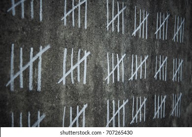 Counting Days In Prison -  Handwritten Lines Of White Chalk