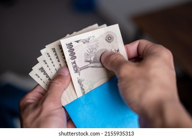 Counting Japanese Money From The Envelope. Receive Salary From Japanese Company Which Is Paid In Cash