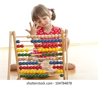 counting little girl with abacus - Powered by Shutterstock