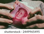 Counting yuan banknotes close up. Renminbi official currency of China.