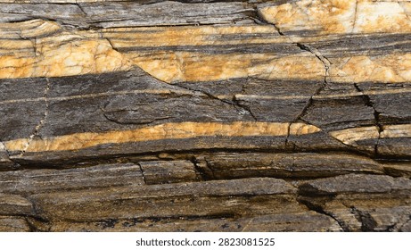 Countless layers of rock, with different textures and mineralisation. An open book that only a privileged few have learnt to read.