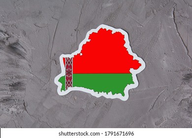 Country Border Outline Map Of Belarus. Shape And National Flag Of The Republic Of Belarus On Grey Concrete Background. Election Concept.