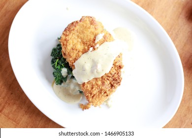 Country Fried Chicken With Mashed Potatoes And Greens With Gravy