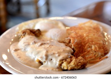 Country Fried Steak Breakfast With Eggs And Hash Browns.