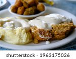 Country Fried Steak with mashed potatoes, gravy and fried okra