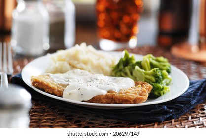 Country Fried Steak With Southern Style Peppered Milk Gravy Shot In Panorama Style