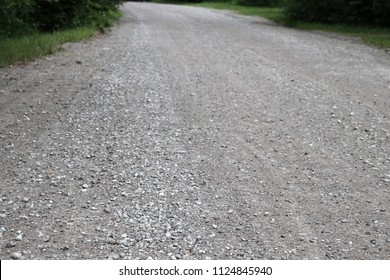 Country gravel  road. Empty road concept