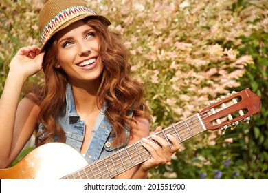 Country hippie girl with guitar