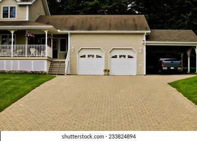 Country Home With A Double Garage And A Truck Under Carport